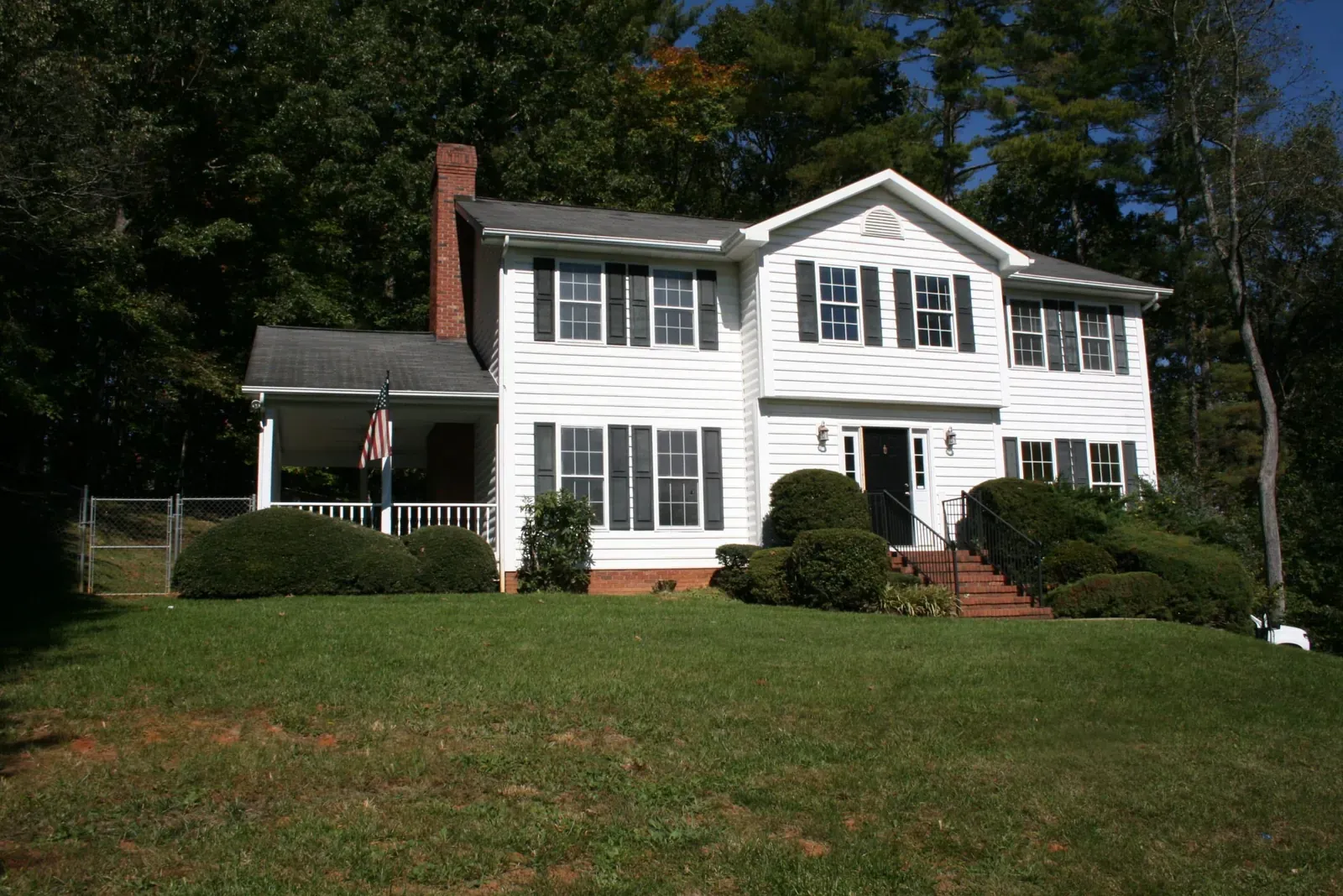 Front lawn and porch of a custom colonial home in Weaverville, NC, built by Buckingham Builders